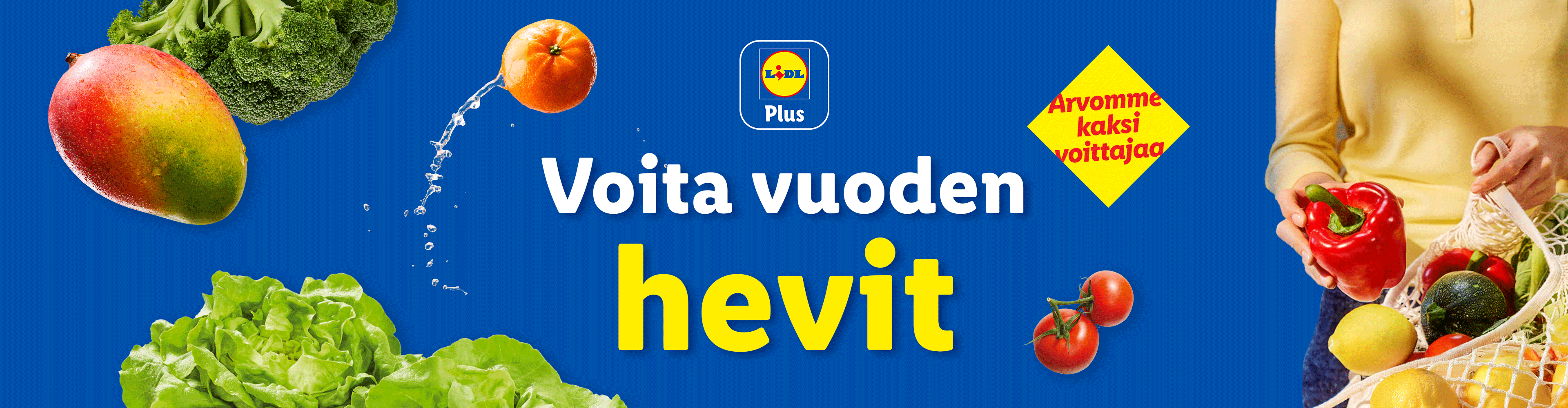 Vihanneksia ja hedelmiä, kuten mango, appelsiini, parsakaali, kurpitsa, tomaatit ja salaatti. Teksti: Voita vuoden hevit.